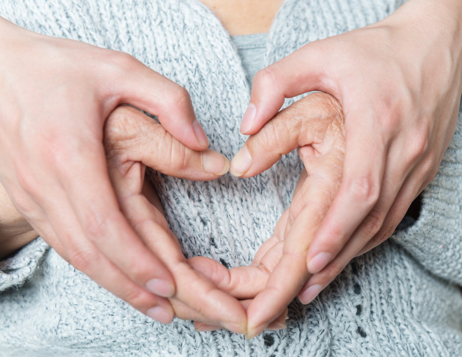 Compassionate caregiver supporting an elderly resident at Soul New Hope assisted living in Winchester, California